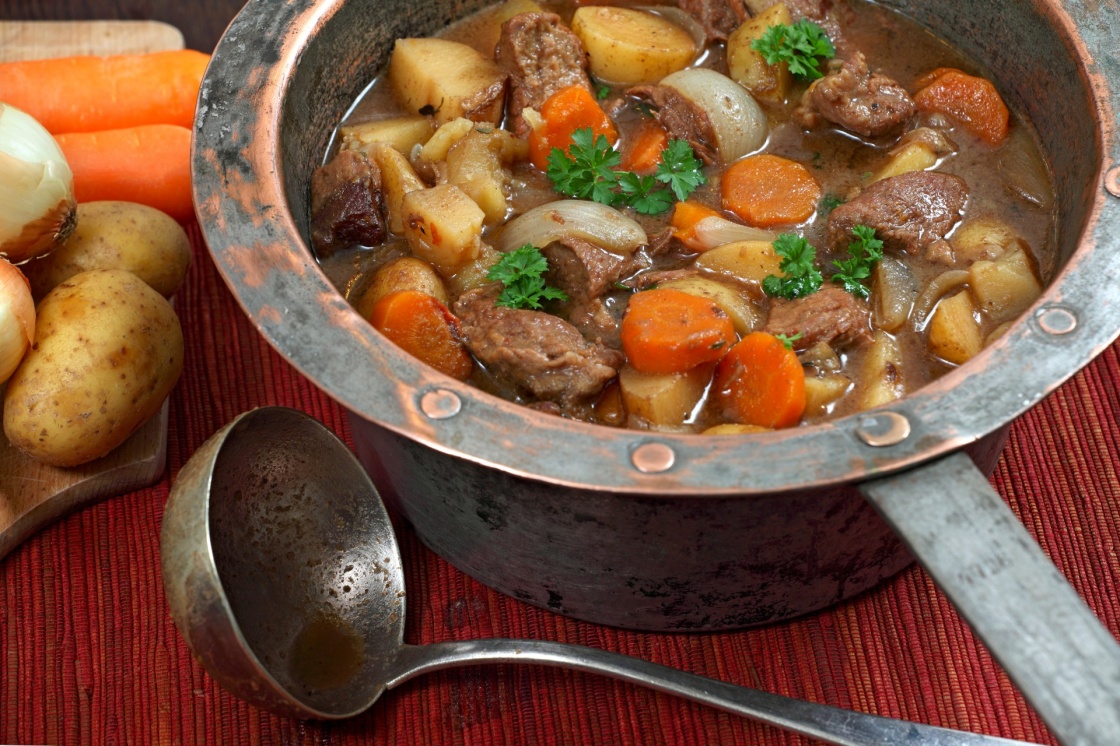 'Photo of of Irish Stew or Guinness Stew made in an old well worn copper pot.' - Ireland